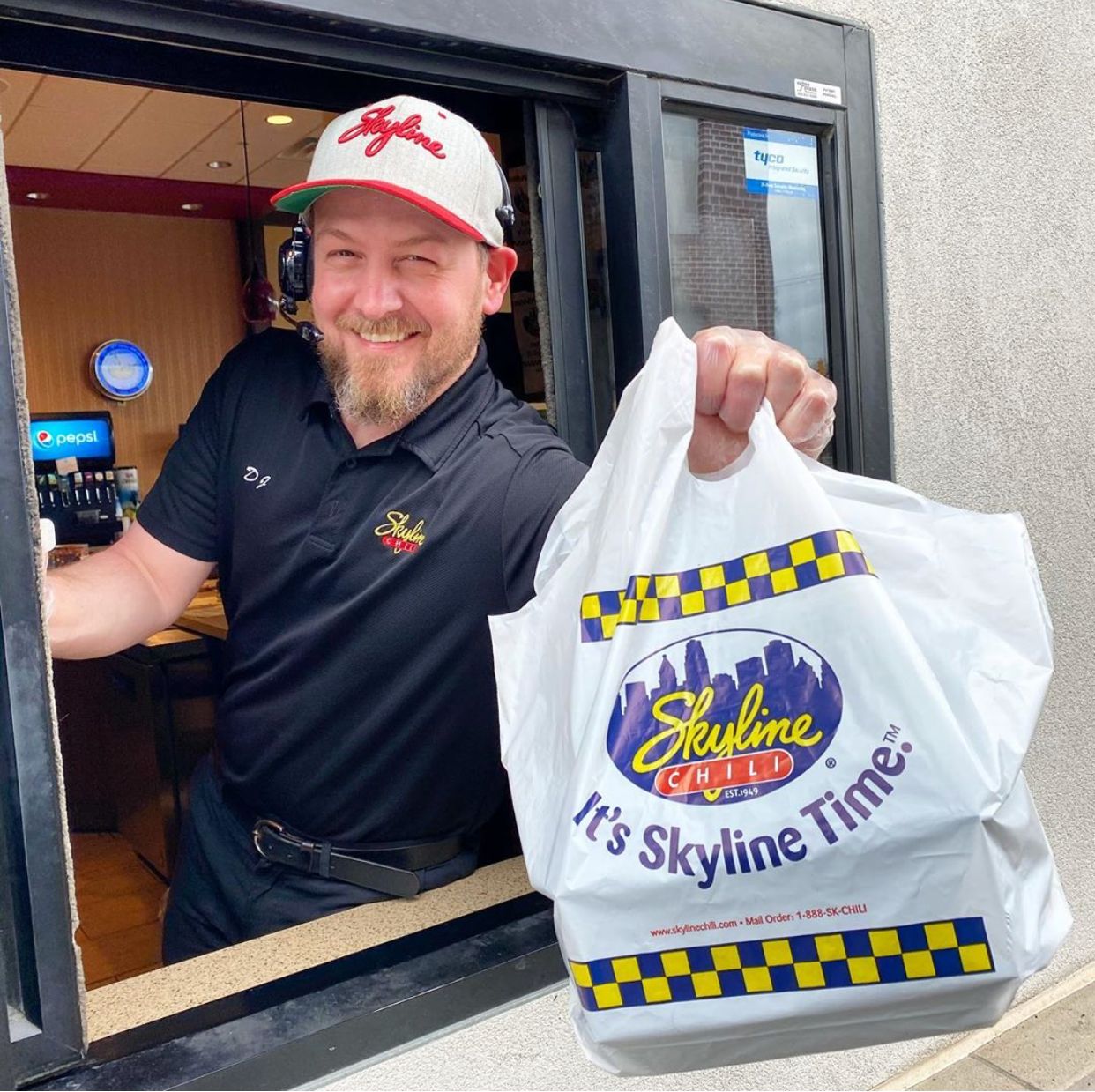 picture of employee at the drive thru window