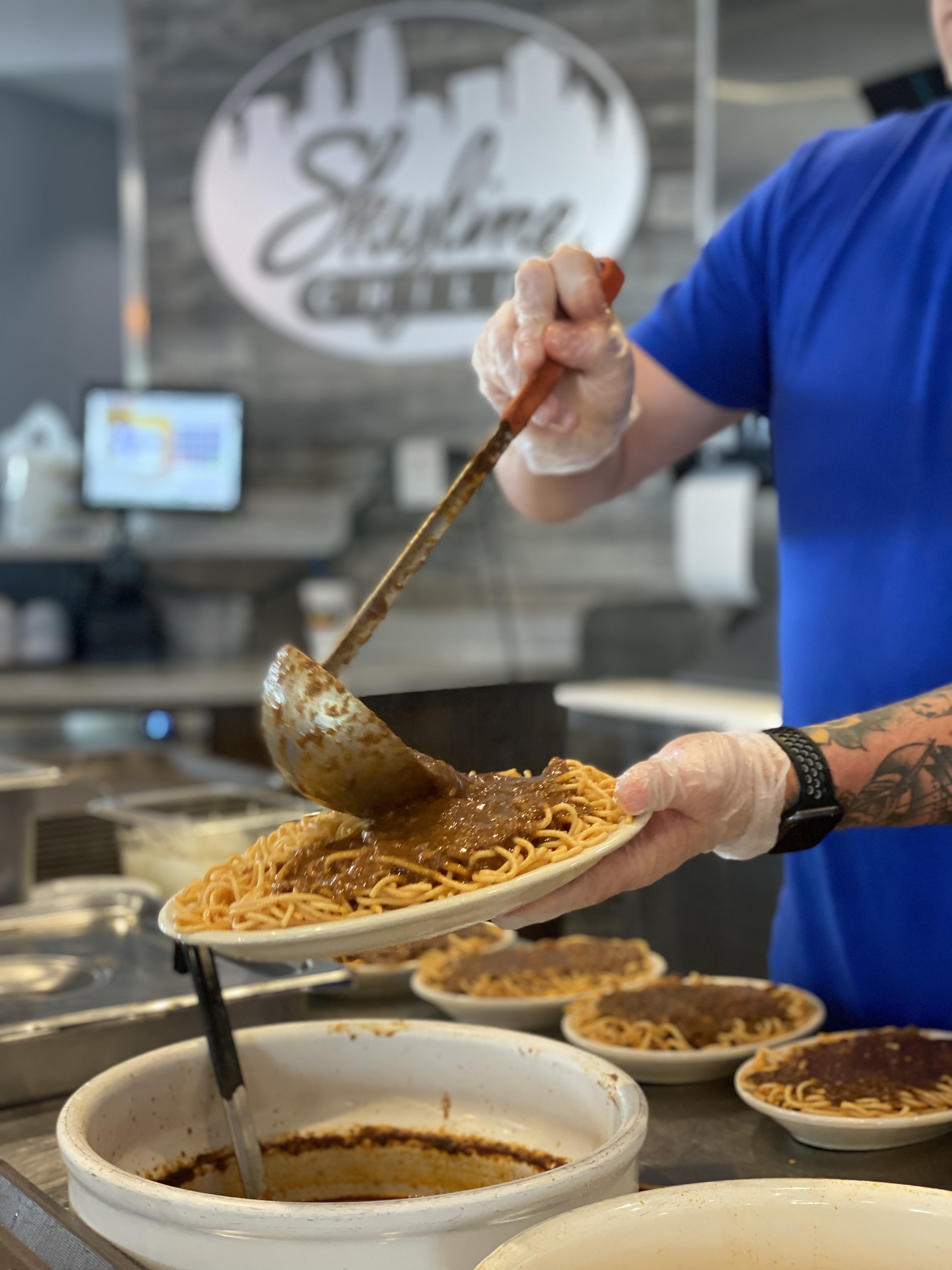 serving a plate of chili
