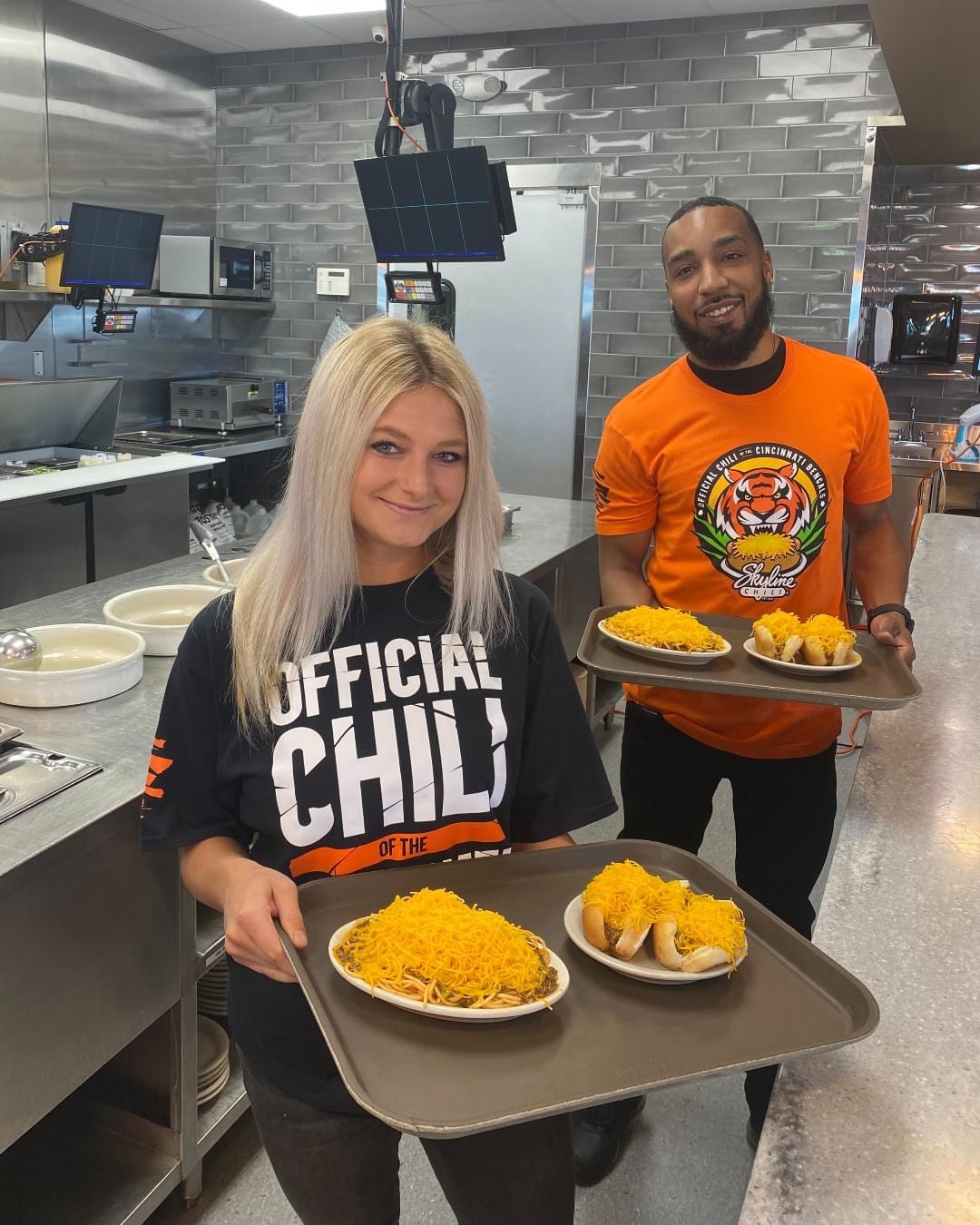 two people with trays of food