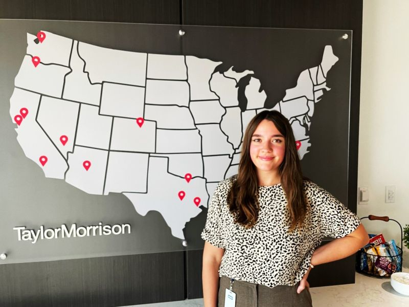 woman standing in front of a map