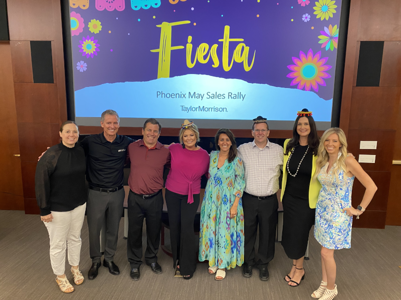 team in front of a fiesta background