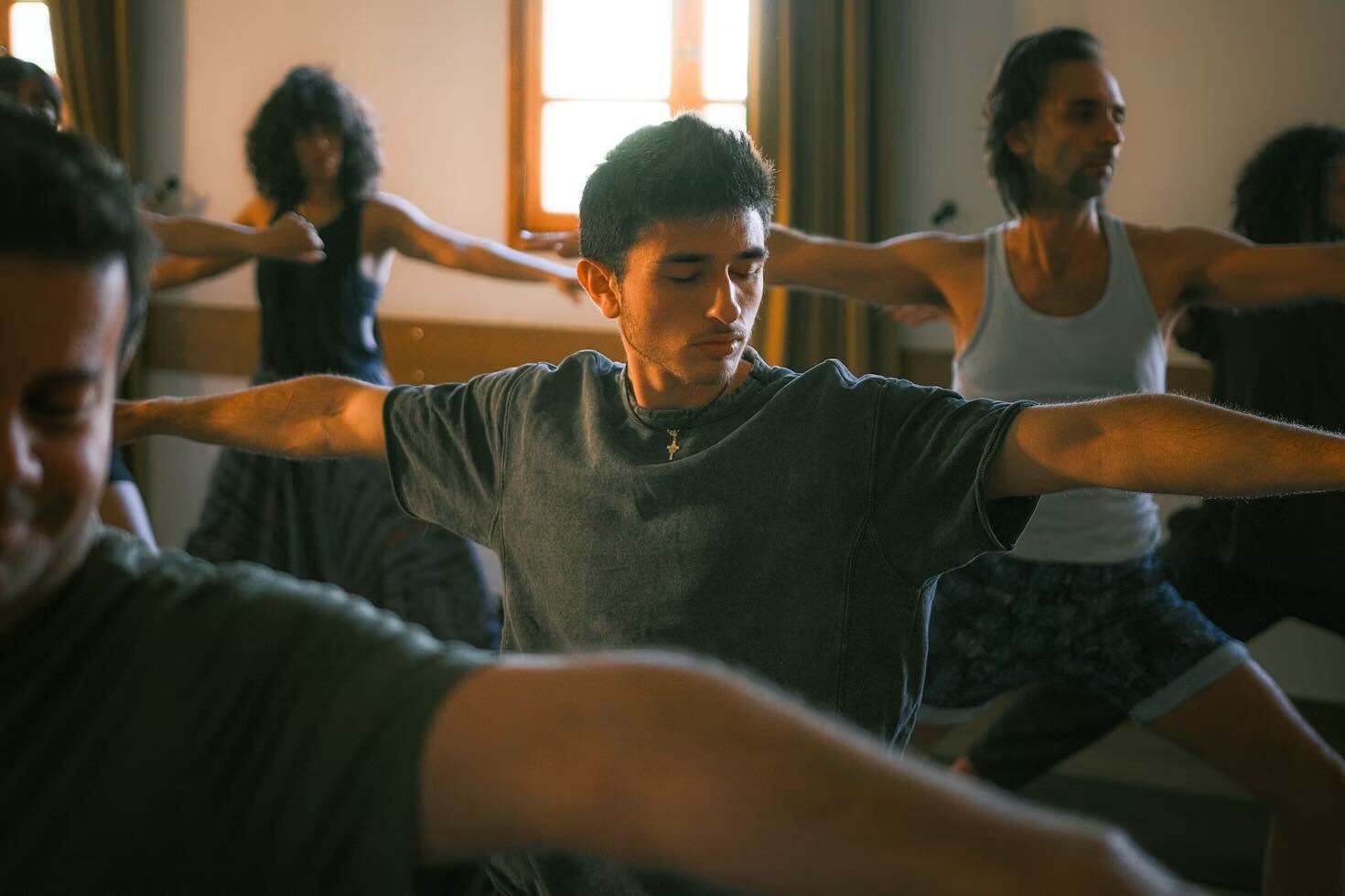 Person practicing mindfulness with singing bowls