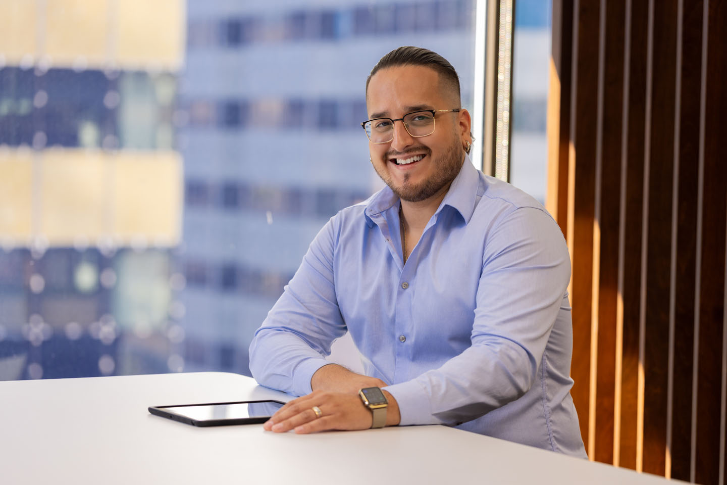 a man smiling at the camera