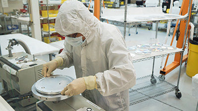 person inspecting a machine