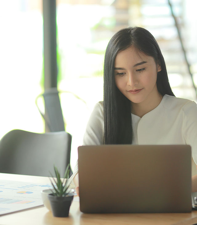 Woman working on laptop computer