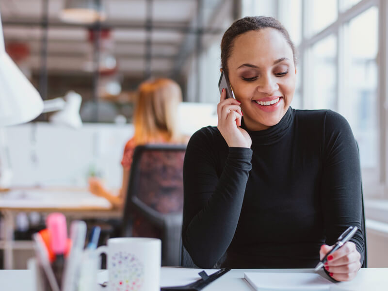 Smiling woman on the phone