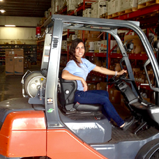 woman driving a forklift