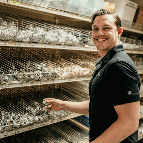 man at a parts bin
