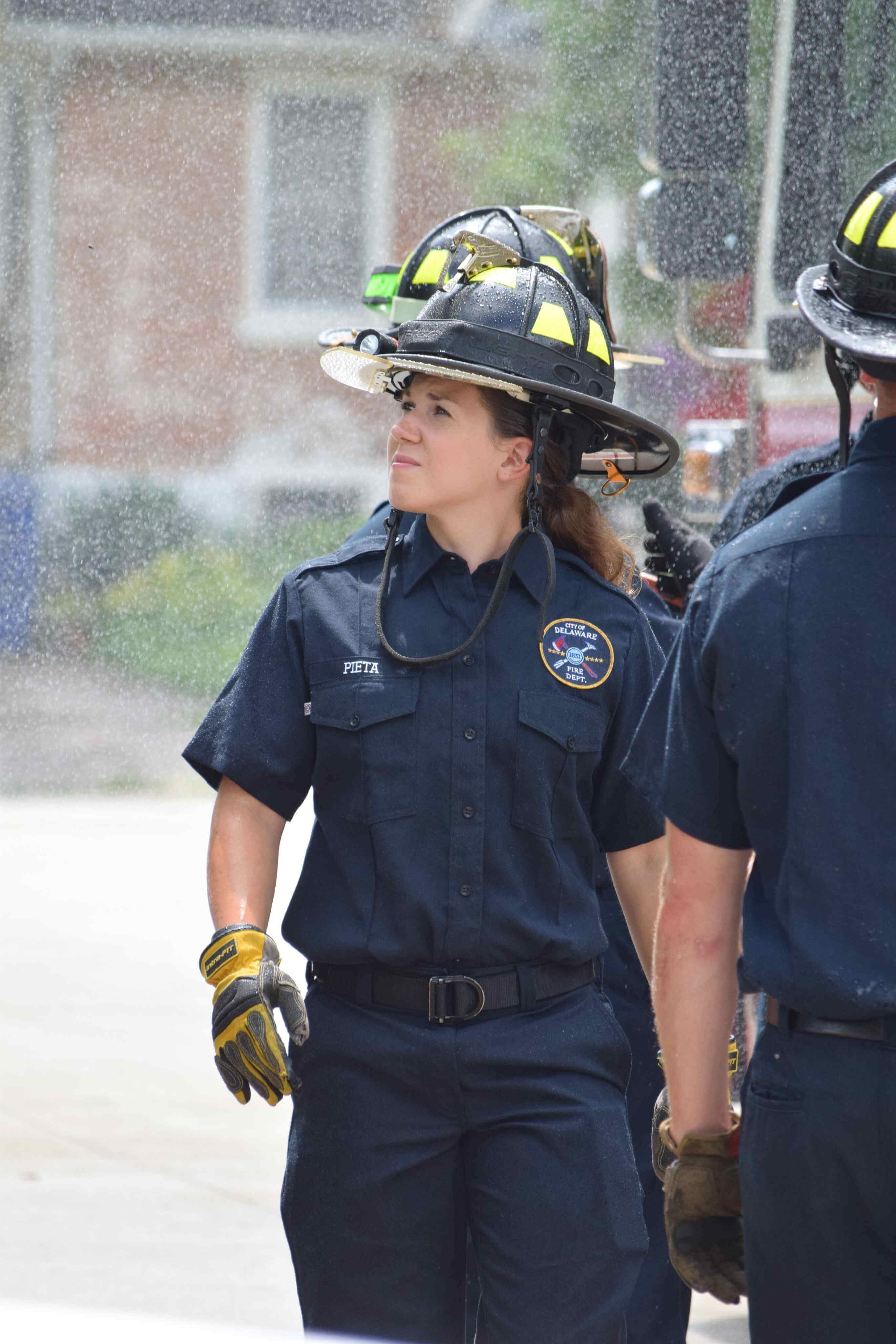 A female police officer is wearing a helmet