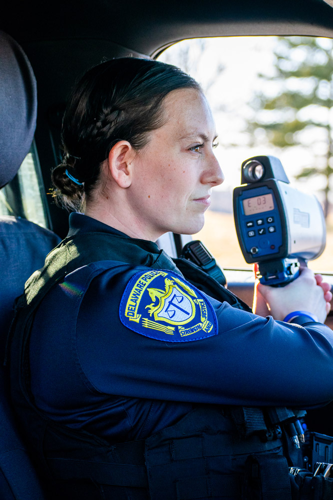 Female police officer using speed gun