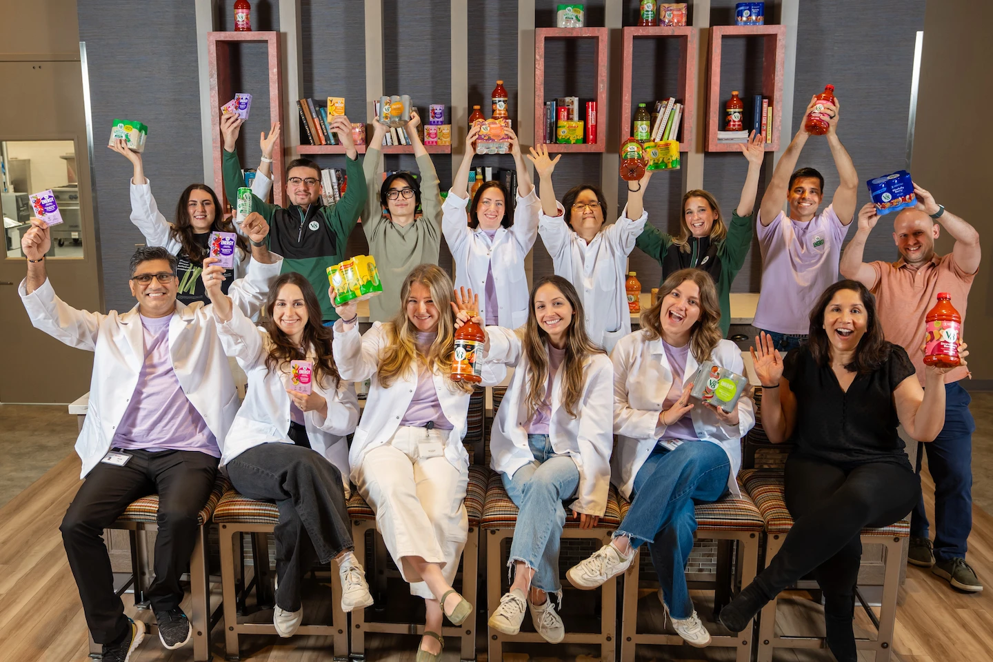 Group of people celebrating in office