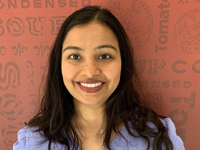 Meeta with Campbell's banner