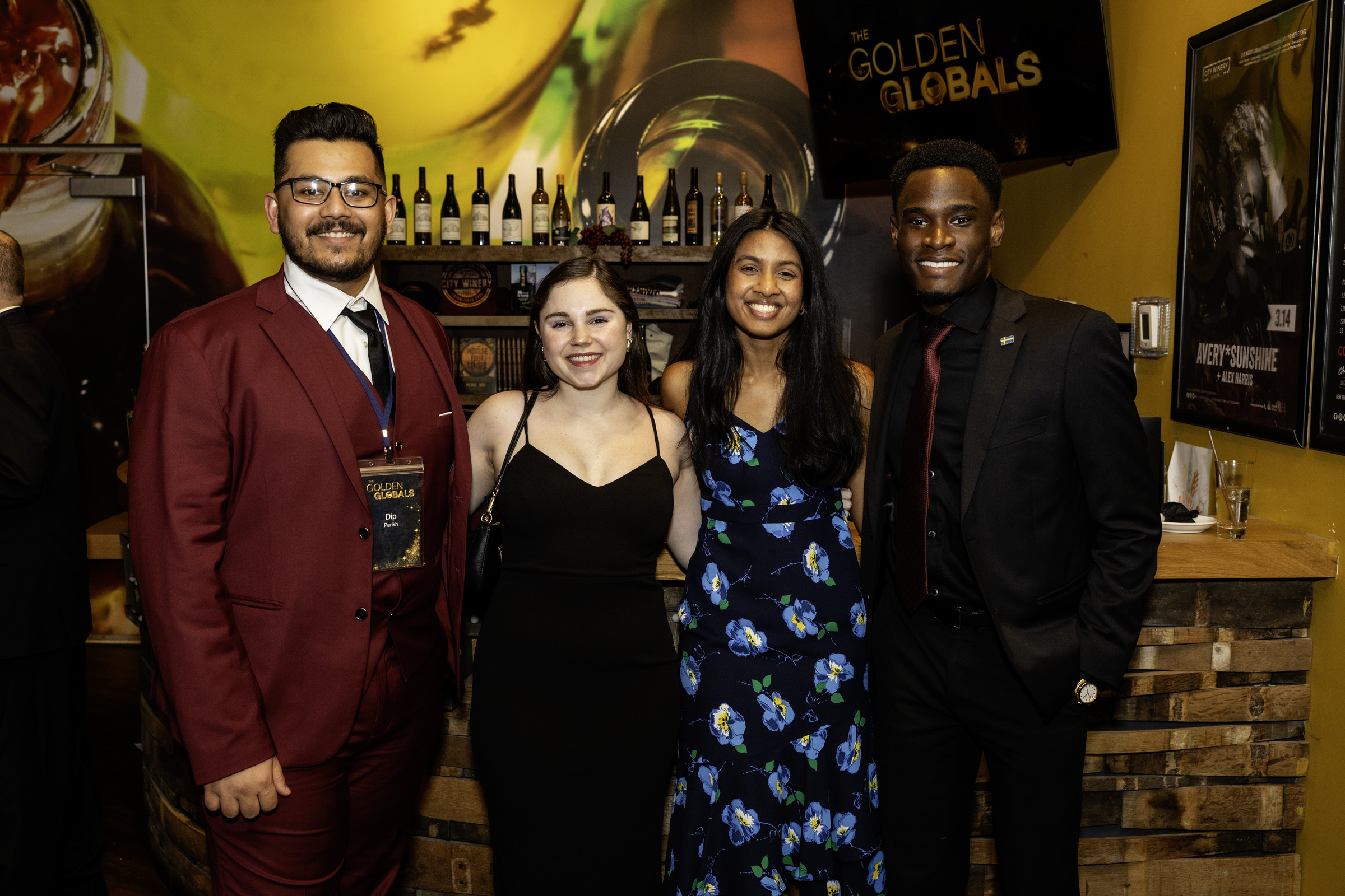 A group of people of six people gather for a photo outside taken outside