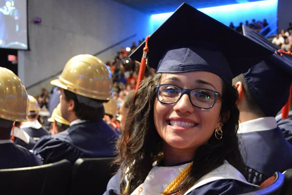 Picture of a graduate wearing a mortar board