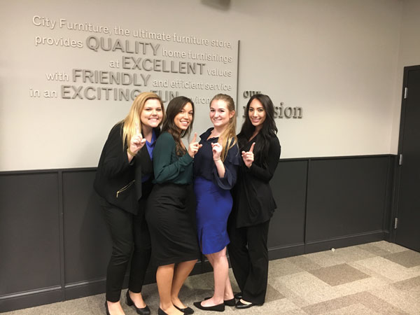 four interns standing together