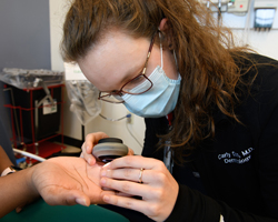Woman treating patient