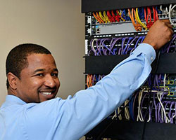 man adjusting wiring