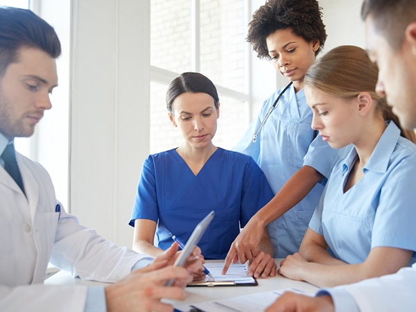 medical team looking at recoreds