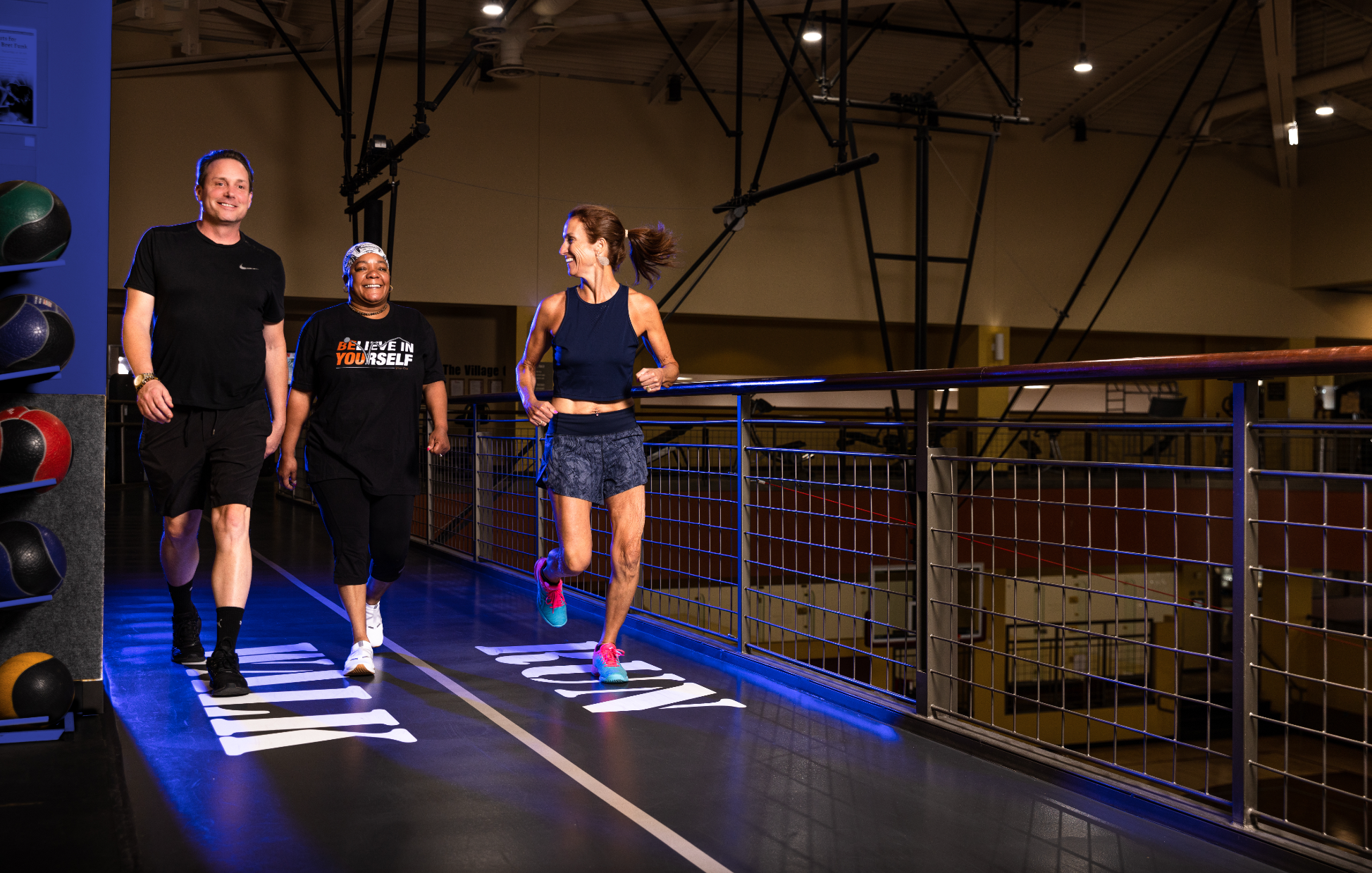 3 people running and smiling