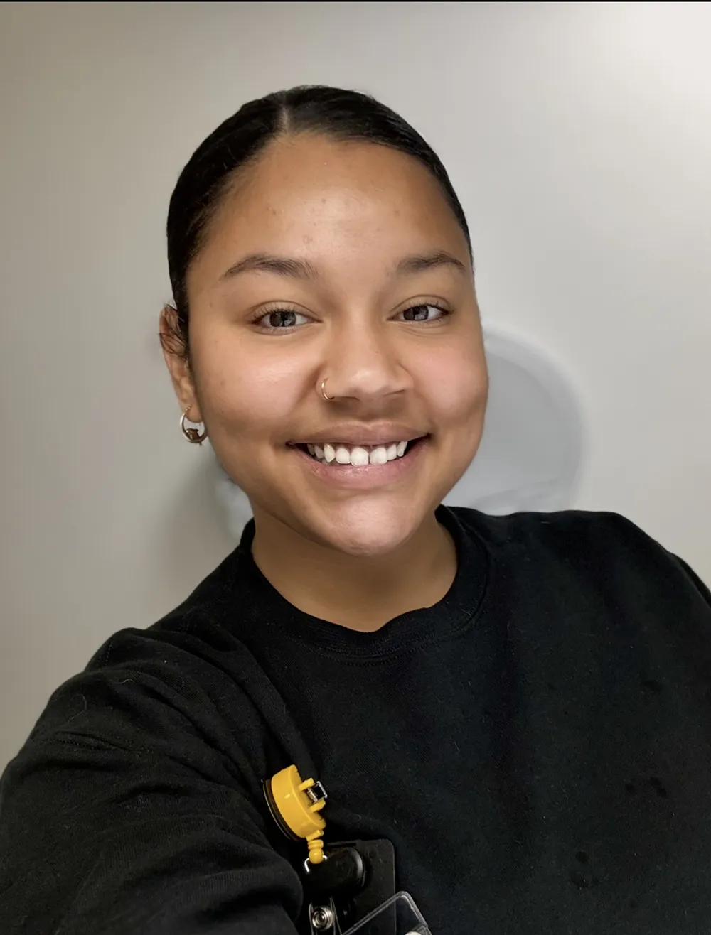Smiling woman in a black shirt for