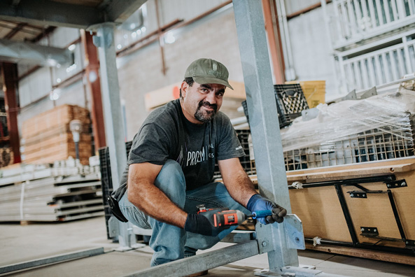 PROEM Employee working at a warehouse.