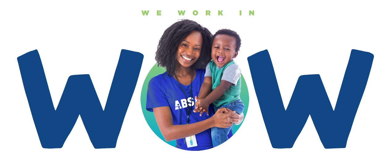 a woman holding a child.  They are both smiling.