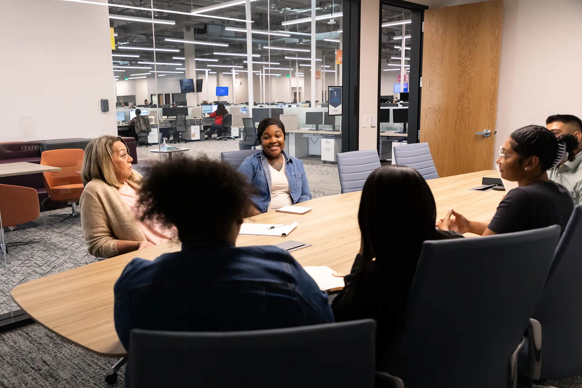 Some people discussing in the meeting room