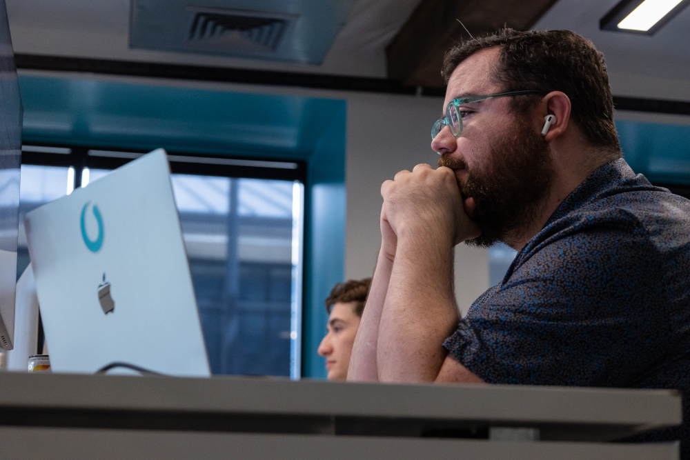 a man concentrating at a desk